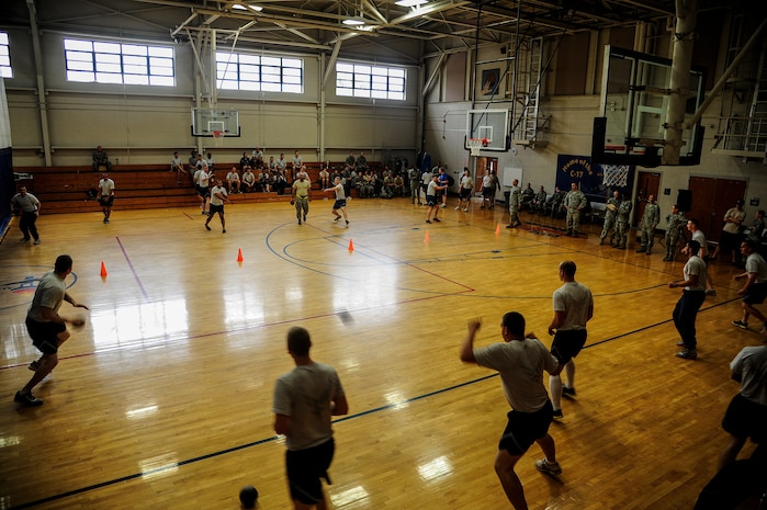 Airmen from the Joint Base Charleston – Air Base dorms scramble to take out their opponents during the Dorm Challenge dodgeball game April 12, 2013, at the Fitness Center at JB Charleston, S.C. The quarterly Dorm Competition is a Wing initiative intended to encourage and incorporate all aspects of Comprehensive Airman Fitness, while encouraging resident interaction and camaraderie. The Dorm Challenge consisted of push-ups, sit-ups, cornhole and a game of dodgeball. (U.S. Air Force photo/Staff Sgt. Rasheen Douglas) 