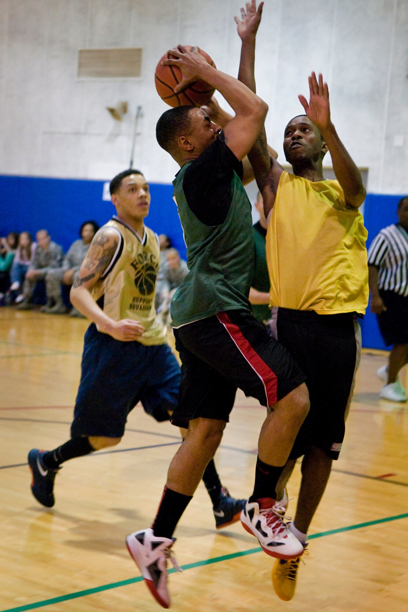 GRISSOM AIR RESERVE BASE, Ind. --  Derrick Harper, 434th Security Forces Squadron team member, goes head to head with Michael Ballard, 434th Force Support Squadron team member, during an annual basketball tournament here April 13. SFS ended the tournament with victory over FSS, 29-20. (U.S. Air Force graphic/Senior Airman Jami K. Lancette) 
