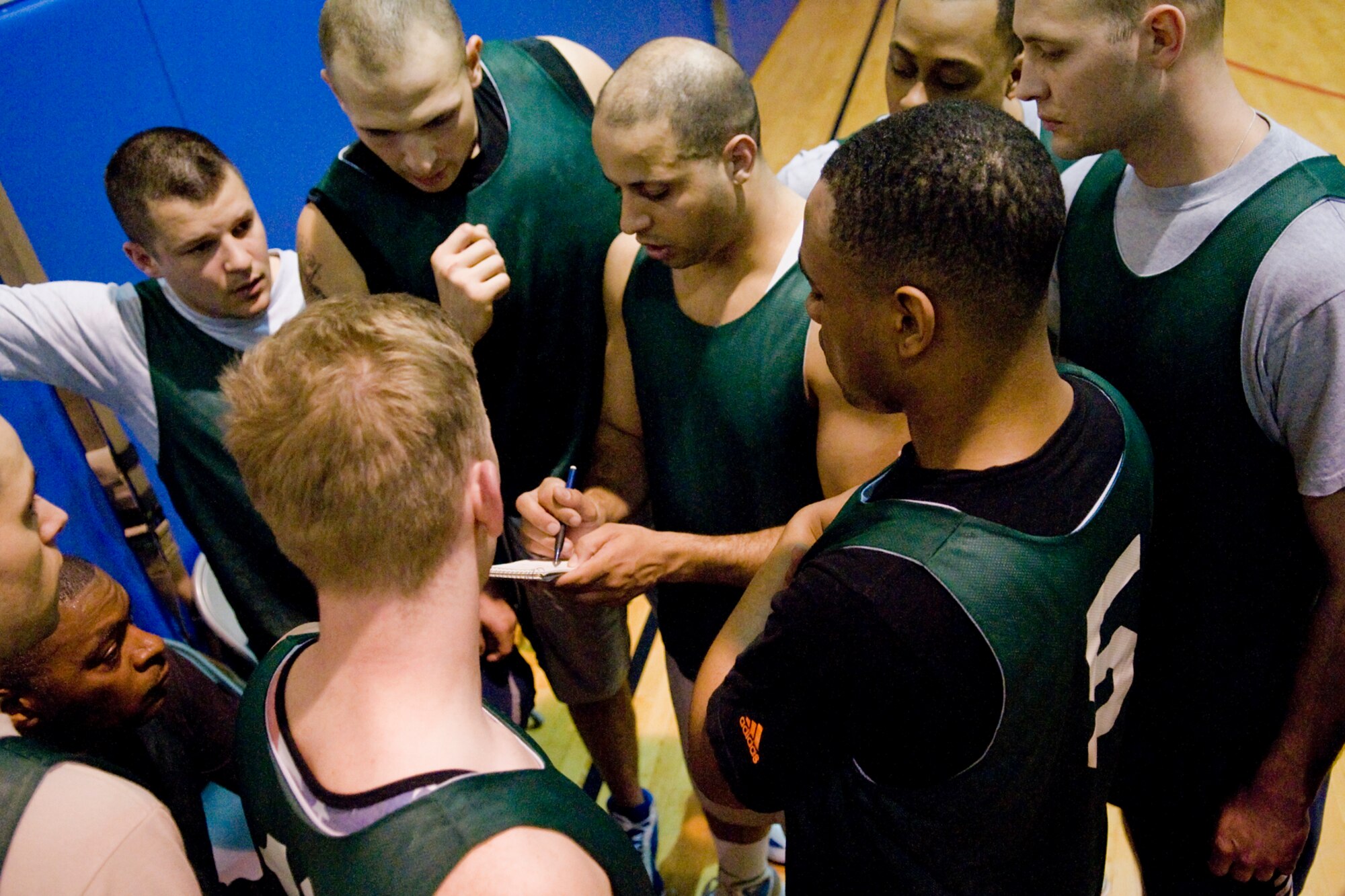 GRISSOM AIR RESERVE BASE, Ind. -- Carl Berry, 434th Security Forces Squadron team member, runs a play by his fellow team mates during an annual basketball tournament here April 13. SFS ended the tournament with victory over the 434th Force Support Squadron, 29-20. (U.S. Air Force graphic/Senior Airman Jami K. Lancette) 
