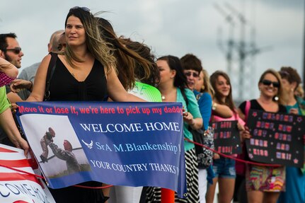 Tawnya Stephen waits for her son-in-law, Senior Airman Michael Blankenship, 560th Red Horse Squadron structural engineer, to exit a plane after he returned home from deployment to the Southwest Asia region April 11, 2013, at Joint Base Charleston – Air Base, S.C. The group arrived back home to a cheering crowd of family and friends. (U.S. Air Force photo/ Senior Airman George Goslin)
