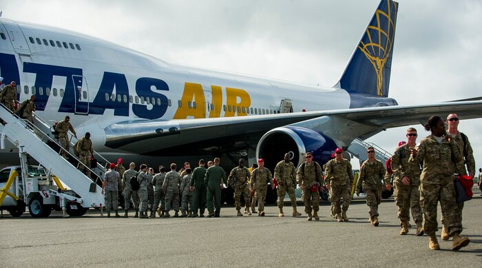 Members of the 560th Red Horse Squadron walk towards their friends and family members after returning from deployment  to the Southwest Asia region April 11, 2013, at Joint Base Charleston – Air Base, S.C. The group arrived back home to a cheering crowd of family and friends. (U.S. Air Force photo/ Senior Airman George Goslin)