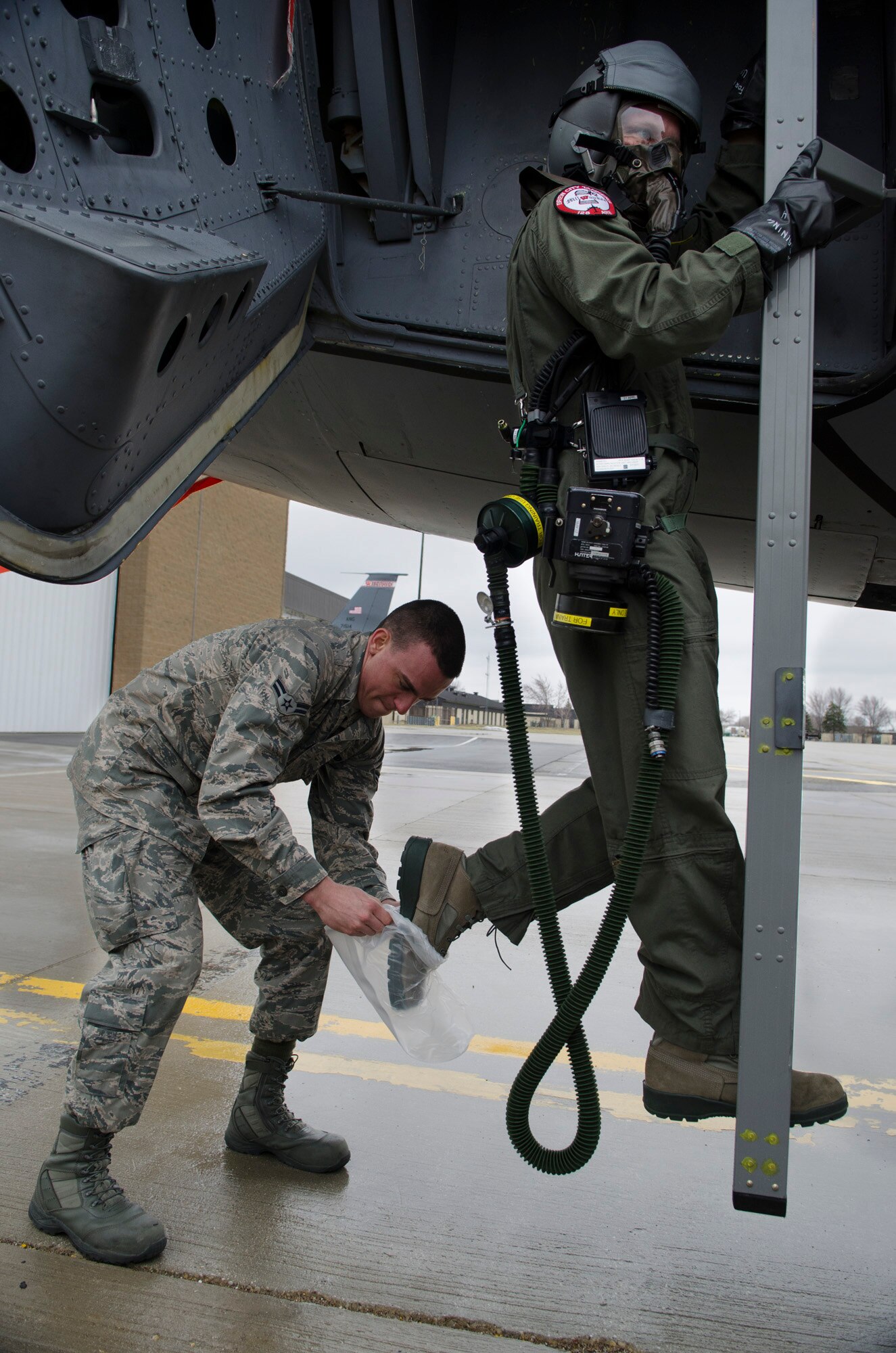 Aircrew Flight Equipment airmen help train a flight crew member at the 128th Air Refueling Wing, in proper procedures of contamination avoidance in an Ability to Survive and Operate exercise, April 14, 2013, at Gen. Mitchell Airfield, Wis. The training exercise helps prepare airmen from the Wisconsin Air National Guard for operations in chemical, biological, radioactive, and nuclear environments. (Air National Guard photo by Tech Sgt. Thomas Sobczyk/Released)