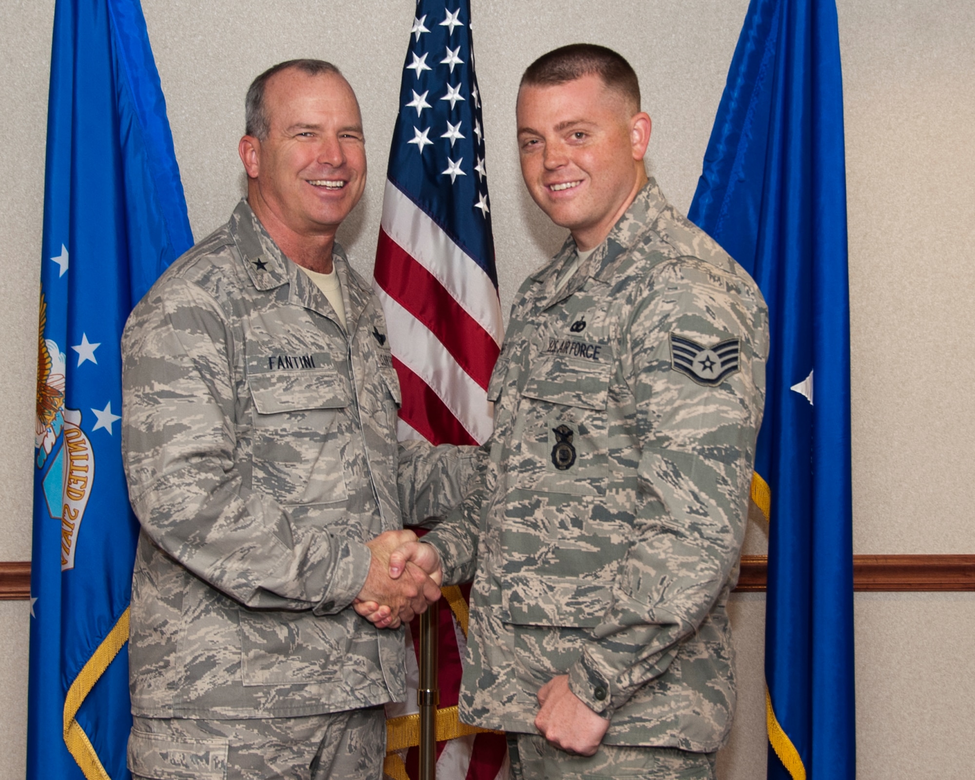 Brig. Gen. Michael Fantini, 82nd Training Wing commander, congratulates Staff Sgt. Jacob Jaynes on being the “Commander’s Wingman of Choice”. Jaynes was selected based on his work ethic and professionalism. (U.S. Air Force photo by Frank Carter)  