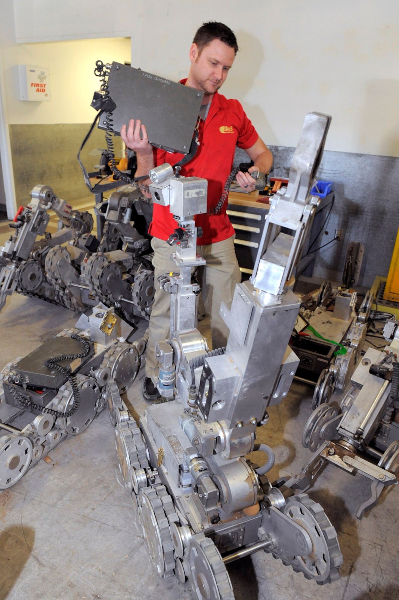 HILL AIR FORCE BASE, Utah -- Jesse Miller, technician at the EOD Equipment Management Facility here prepares to test a newly assembled F6A robot. The EMF serves as a clearinghouse for EOD tools and equipment being shipped back from deployed locations throughout the world. At the EMF, a specialized team inspects, cleans and repairs the equipment before it is redistributed across the Air Force. (U.S. Air Force photo/Todd Cromar)