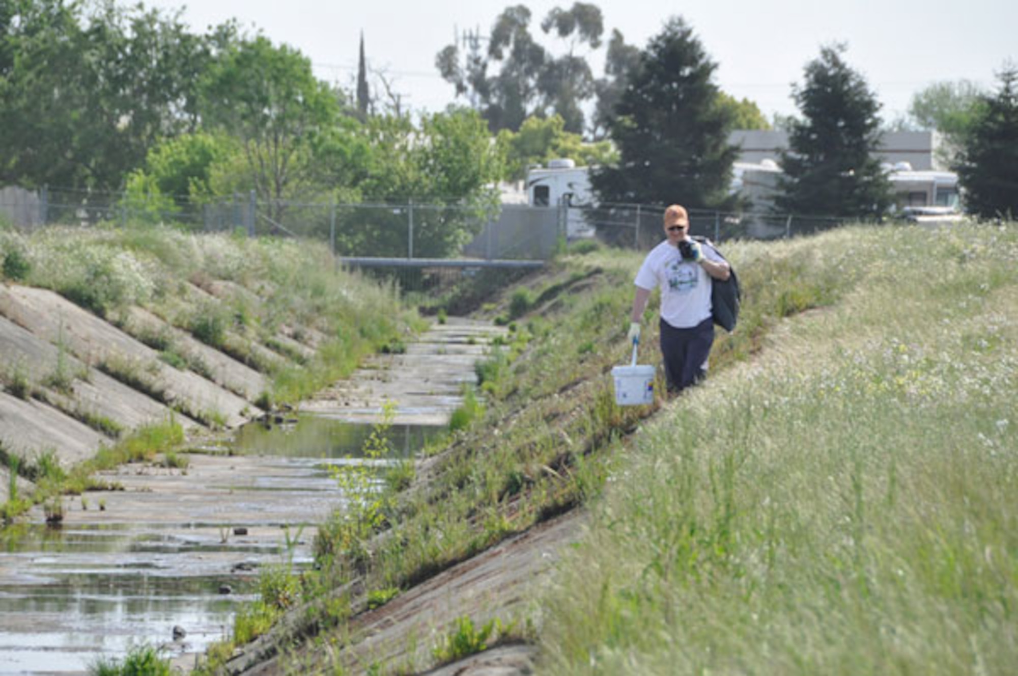 Creek Week: Volunteers pick up litter from two major creeks at the former McClellan Air Force Base as part of the greater Urban Creek Council's awareness campaign.