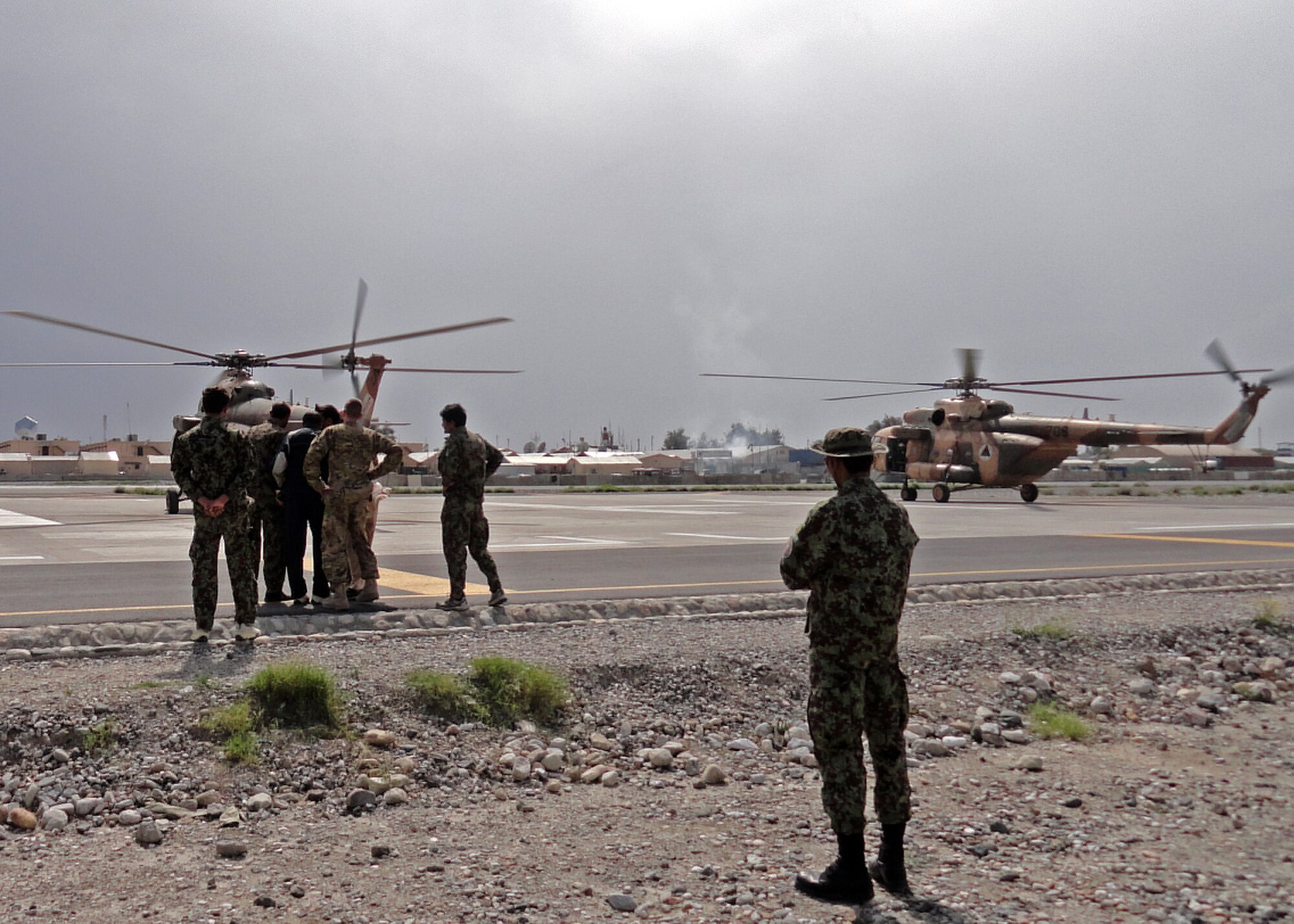 Afghan Air Force and coalition members prepare to launch two Mi-17s in support of an emergency resupply mission April 12, 2013 at Jalalabad Airfield, Afghanistan. The AAF team received the tasking and, working with NATC-A advisors and coalition forces, deployed two Mi-17s in coordination with two AH-64 Apache helicopters from Task Force Dragon Aerial Weapons Team. (courtesy photos)