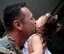 ANDERSEN AIR FORCE BASE, Guam — Staff Sgt. Jonathan Avila, 554th RED HORSE Squadron utilities technician, kisses his daughter during a homecoming in Hangar 1 on Andersen Air Force Base, Guam, April 16, 2013. The 554th RHS was deployed for seven months to Southwest Asia where they supported construction projects for eight different sites in and around the region. (U.S. Air Force photo by Senior Airman Benjamin Wiseman/Released)