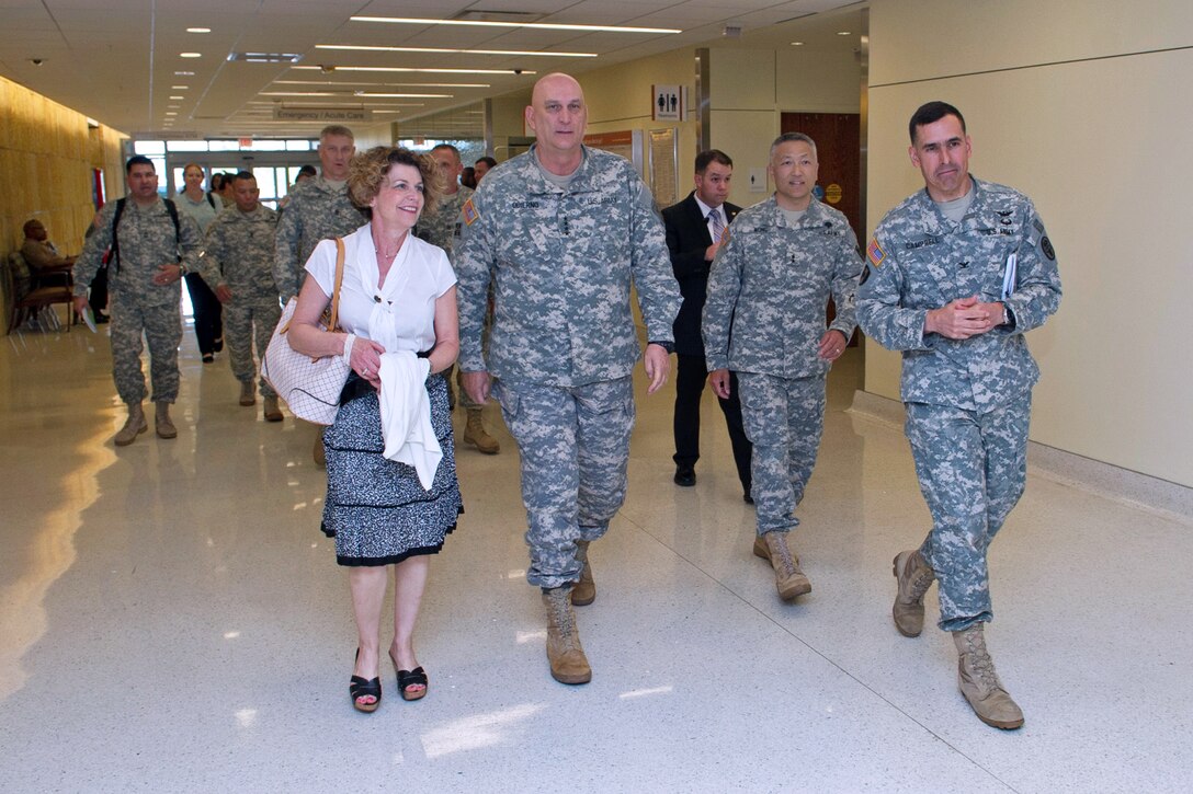 Army Chief of Staff Gen. Ray Odierno, his wife, Linda, and Sgt. Maj. of the Army Raymond F. Chandler III tour Brooke Army Medical Center on Joint Base San Antonio-Fort Sam Houston, Texas, April 16, 2013. Army Col. Kyle D. Campbell, right, commander of Brooke Army Medical Center, and Army Maj. Gen. M. Ted Wong, second from right, commanding general of the Southern Medical Regional Command, led the tour.