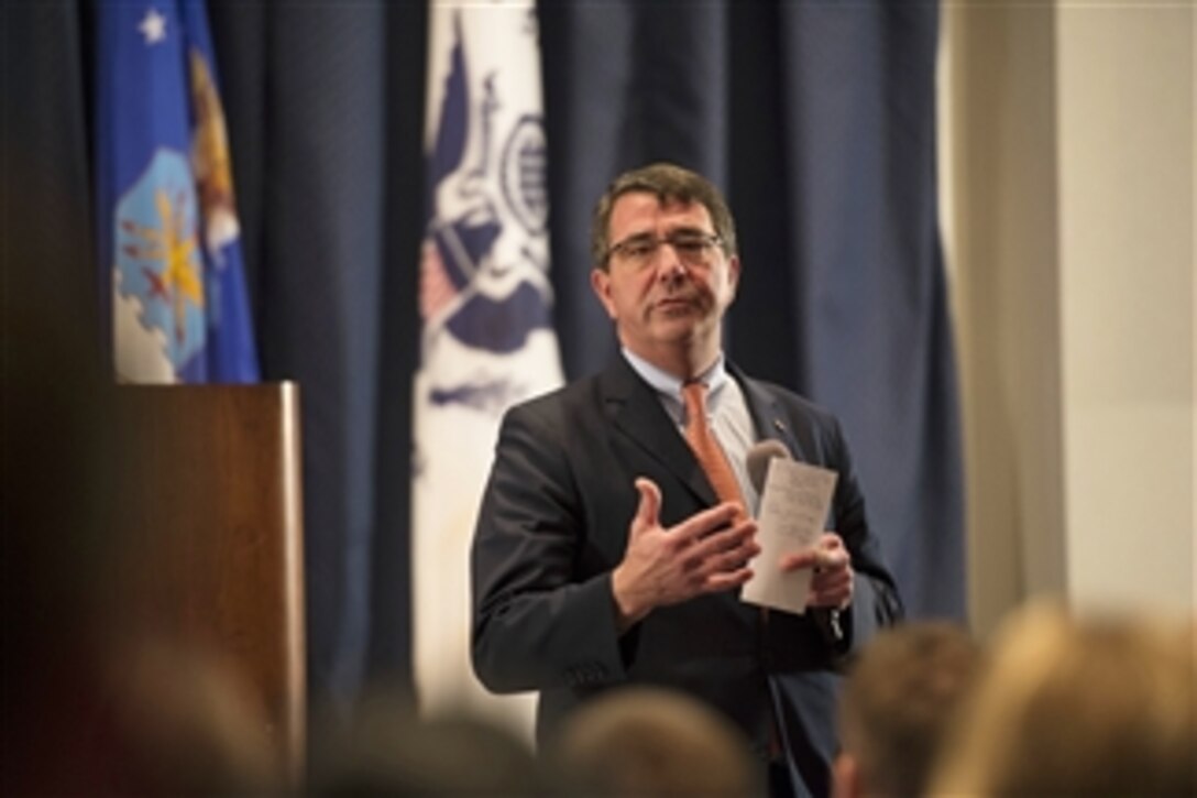 Deputy Secretary of Defense Ashton B. Carter addresses troops and civilian workers of the Air Mobility Command during a visit to Scott Air Force Base, Ill., on April 16, 2013