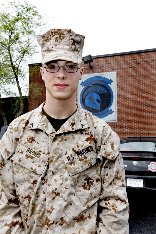 Pfc. Hunter Brown, an administrative specialist with Marine Wing Communications Squadron 28, stands in front of the MWCS-28 supply building April. 16