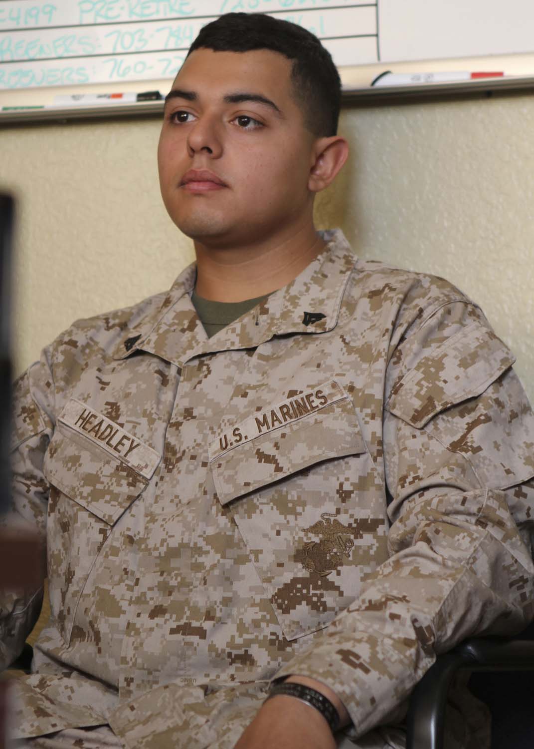 Corporal William G. Headley, a motor transport operator serving with Headquarters Battalion, 1st Marine Division, listens to a career planner discuss his reenlistment opportunities here, April 17, 2013. Headley, a native of Gilroy, Calif., visited the career planner as a requirement for Marines with one year left on their current enlistments.

