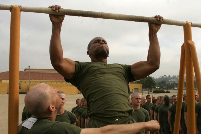 A recruit of Company H, 2nd Recruit Training Battalion, gives maximum effort during the pull-ups portion of the Physical Fitness Test aboard Marine Corps Recruit Depot San Diego March 29. The PFT is used to gauge the endurance of recruits after the first phase of training.