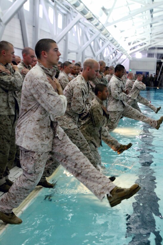 Recruits of Company A, 1st Recruit Training Battalion, step into the shallow end of the pool during the first event of the Swim Qualification aboard Marine Corps Recruit Depot San Diego, April 8.  Recruits must qualify at the basic water survival level in order to graduate recruit training.