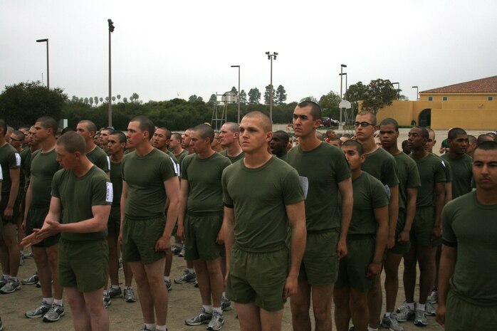 Lance Cpl. Maximilian J. Musick, Platoon 1027, Company B, 1st Recruit Training Battalion waits in line for pull-ups during the final Physical Fitness Test aboard Marine Corps Recruit Depot San Diego March 4.  Musick rushed to the front of the line to set the example for other recruits since he is able to score a high first class PFT score.