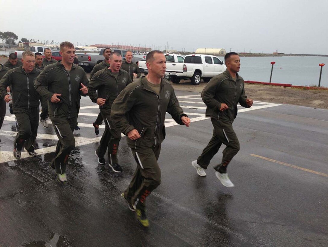Corporals Leadership Summit 1-13 – Class PT – Summit Director (1stSgt Fleming) and SNCOIC (SSgt Tedtaotao) lead the Class in front of the Battalion CP.