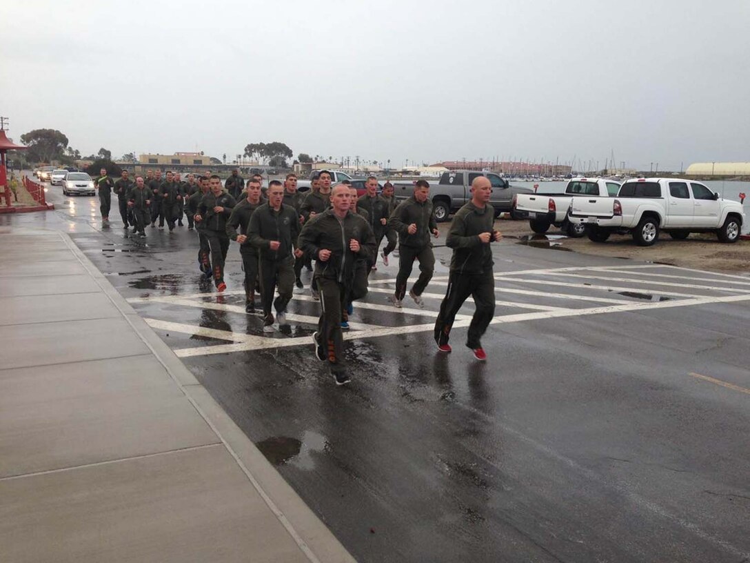 2nd Squad, Corporals Leadership Summit 1-13 – Class PT – Squad Instructor Sgt Richardson from Echo Company leads his squad in front of the Battalion CP.
