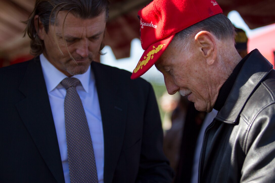 Trevor Hoffman, former San Diego Padres pitcher and soon-to-be Baseball Hall of Fame inductee, greets a retiree after a morning colors ceremony aboard Marine Corps Air Station Miramar, Calif., April 18. Hoffman comes from a long line of service members.