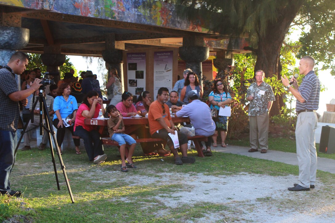 Tim Robert, lead operational planner at Marine Forces Pacific, speaks to local residents at an outdoor communal beach shelter April 12 during the last in a series of public scoping meetings.  The meetings allowed government officials to provide information, answer questions and seek public input on the current preliminary alternatives proposed in the CNMI Joint Military Training Environmental Impact Statement and Overseas EIS.  
