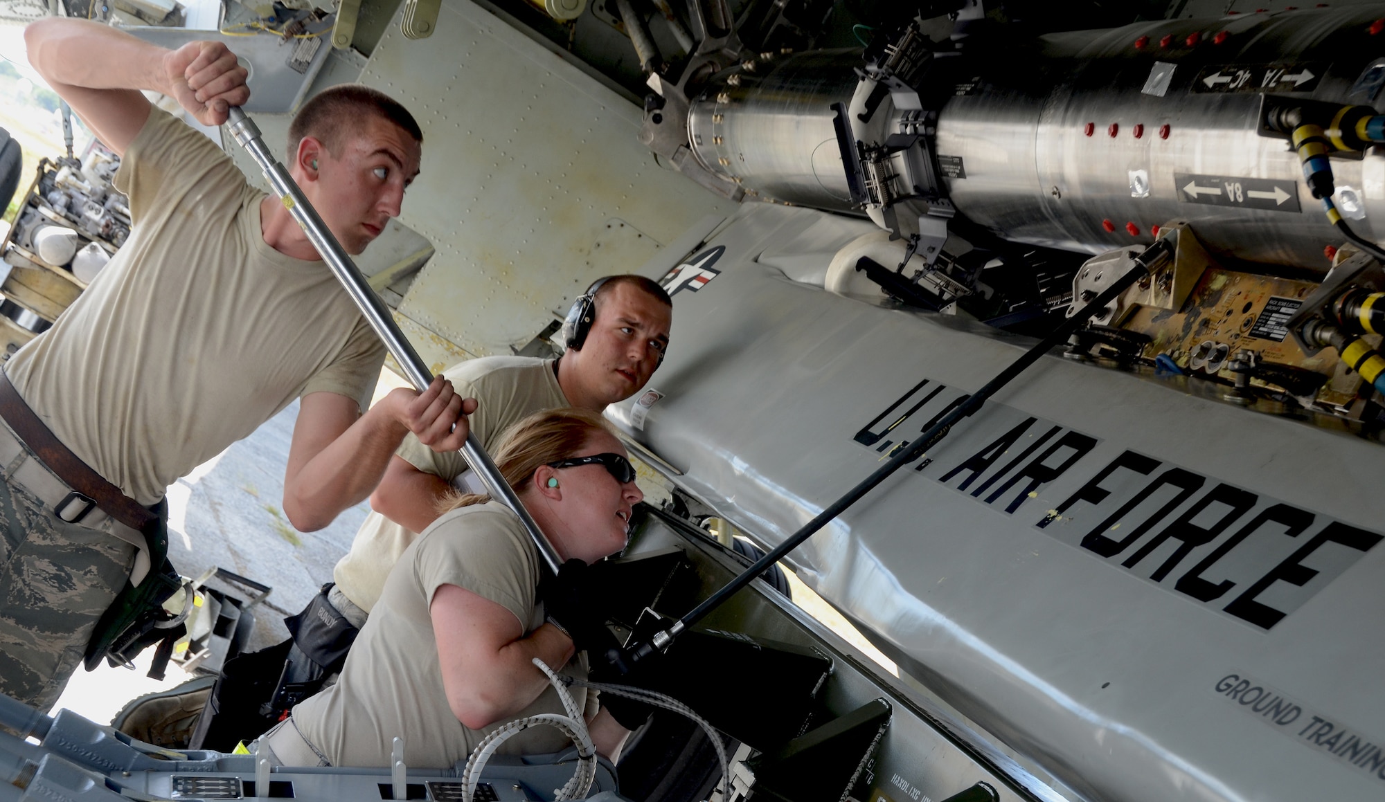 Airmen from the 36th Expeditionary Aircraft Maintenance Squadron, deployed from the 23rd Expeditionary Aircraft Maintenance Unit, Minot Air Force Base, N.D., load a training AGM-86C Conventional Air-Launched Cruise Missile on to a B-52 Stratofortress during a load demonstration at Andersen Air Force Base, Guam, April 16, 2013. All EAMUs deployed to Andersen have to pass a load inspection within 10 days of arrival as part of a U.S. Pacific Command requirement to ensure all tools and equipment are mission ready. Maintainers also obtain munitions-loading experience in both a training and tropical environment. (U.S. Air Force photo by Senior Airman Benjamin Wiseman/Released)