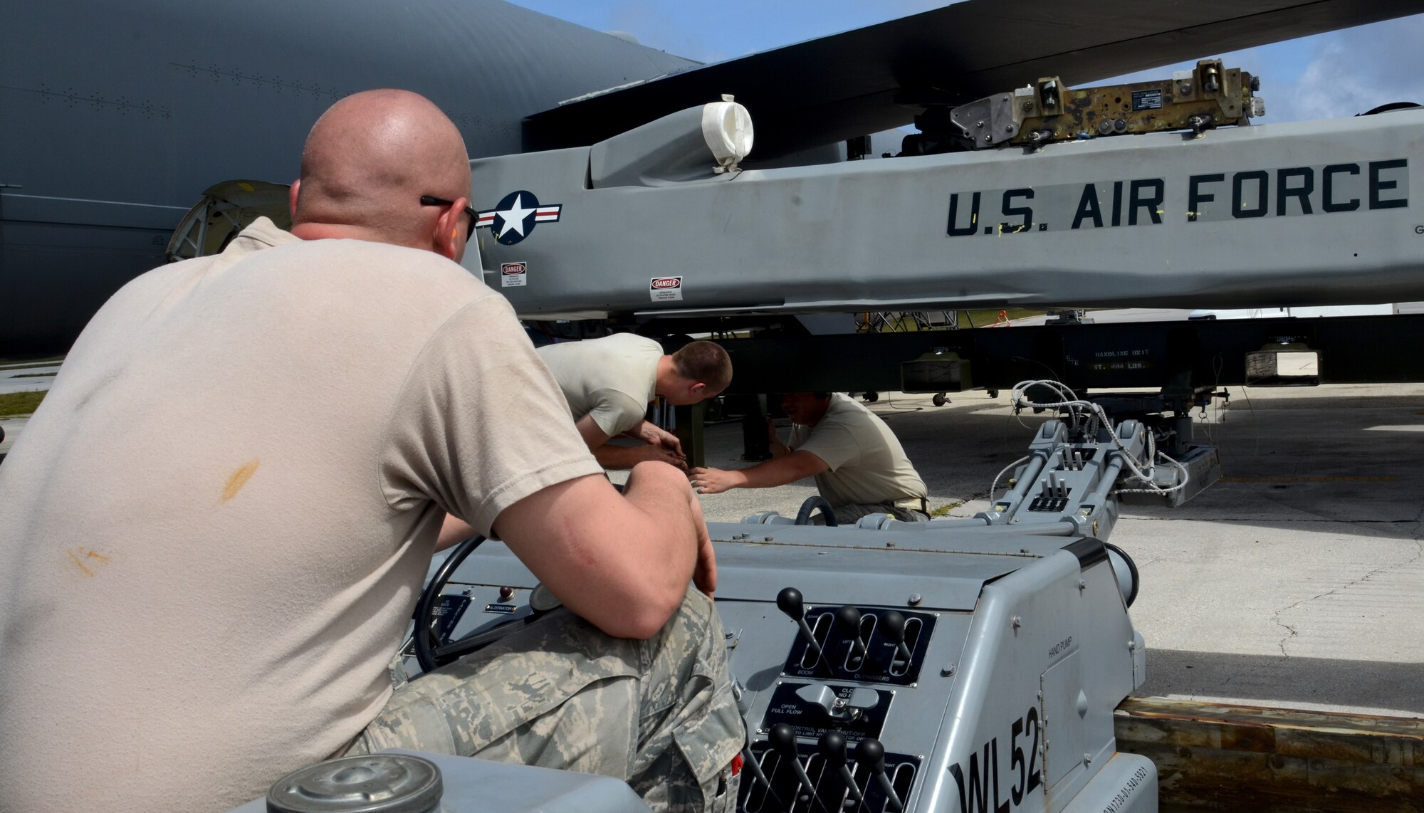 Airmen from the 36th Expeditionary Aircraft Maintenance Squadron, deployed from the 23rd Expeditionary Aircraft Maintenance Unit, Minot Air Force Base, N.D., prepare a training AGM-86C Conventional Air-Launched Cruise Missile for loading  on to a B-52 Stratofortress during a load demonstration at Andersen Air Force Base, Guam, April 16, 2013. All EAMUs deployed to Andersen have to pass a load inspection within 10 days of arrival as part of a U.S. Pacific Command requirement to ensure all tools and equipment are mission ready. It is opportunity for maintainers to obtain munitions-loading experience in both a training and tropical environment. (U.S. Air Force photo by Senior Airman Benjamin Wiseman/Released)