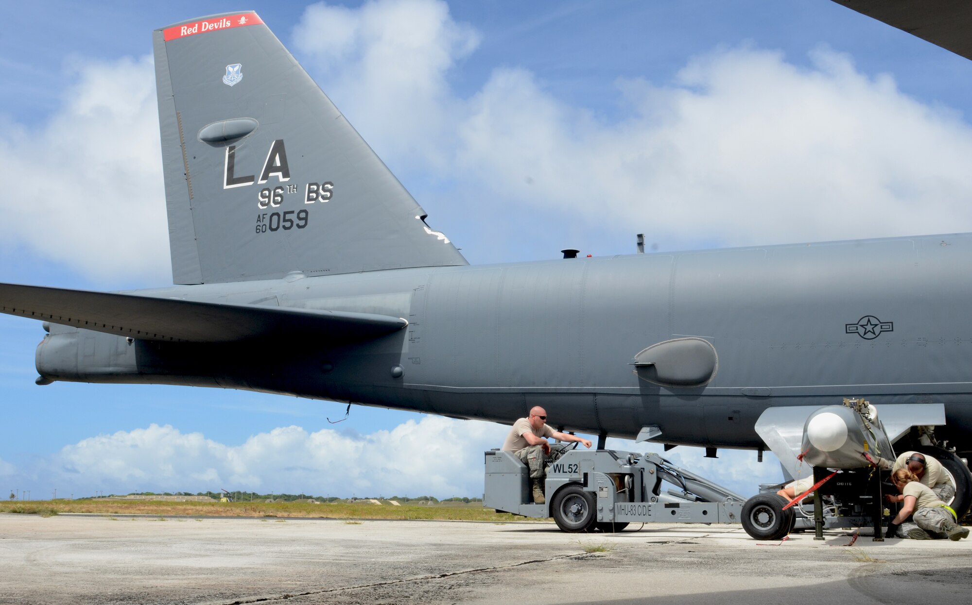 Airmen from the 36th Expeditionary Aircraft Maintenance Squadron, deployed from the 23rd Expeditionary Aircraft Maintenance Unit, Minot Air Force Base, N.D., prepare a training AGM-86C Conventional Air-Launched Cruise Missile for loading on to a B-52 Stratofortress during a load demonstration at Andersen Air Force Base, Guam, April 16, 2013. All EAMUs deployed to Andersen have to pass a load inspection within 10 days of arrival as part of a U.S. Pacific Command requirement to ensure all tools and equipment are mission ready. It is an opportunity for maintainers to obtain munitions-loading experience in both a training and tropical environment. (U.S. Air Force photo by Senior Airman Benjamin Wiseman/Released)
