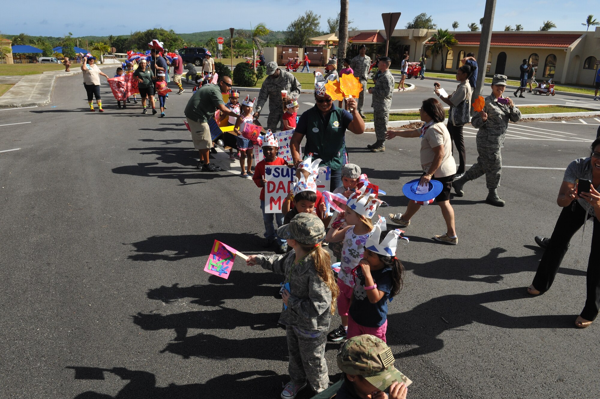 Children from the Andersen Child Development Center walk in the Month of the Military Child parade on Andersen Air Force Base, Guam, April 12, 2013. The Month of the Military Child was created by former Defense Secretary Caspar Weinberger to underscore the important role children play in the armed forces community. (U.S. Air Force photo by Airman 1st Class Adarius Petty/Released)