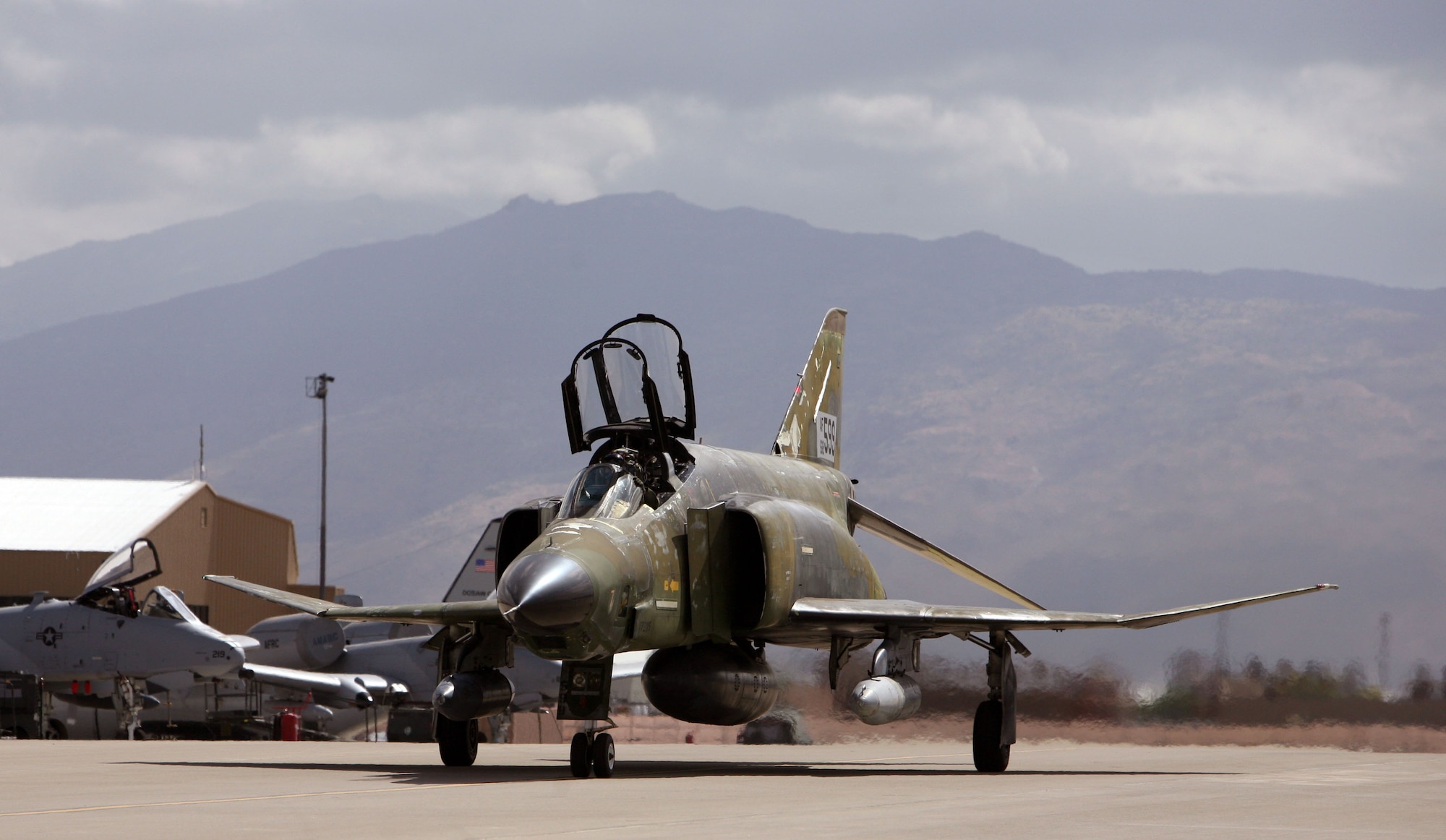 An F-4 Phantom, tail number 68-0599, departs from the 309th Aerospace Maintenance and Regeneration Group at Davis-Monthan Air Force Base, Ariz., April 17, 2013. The aircraft was the last F-4 regenerated by AMARG in support of Air Combat Command’s full-scale aerial target program. (Courtesy photo/Released)