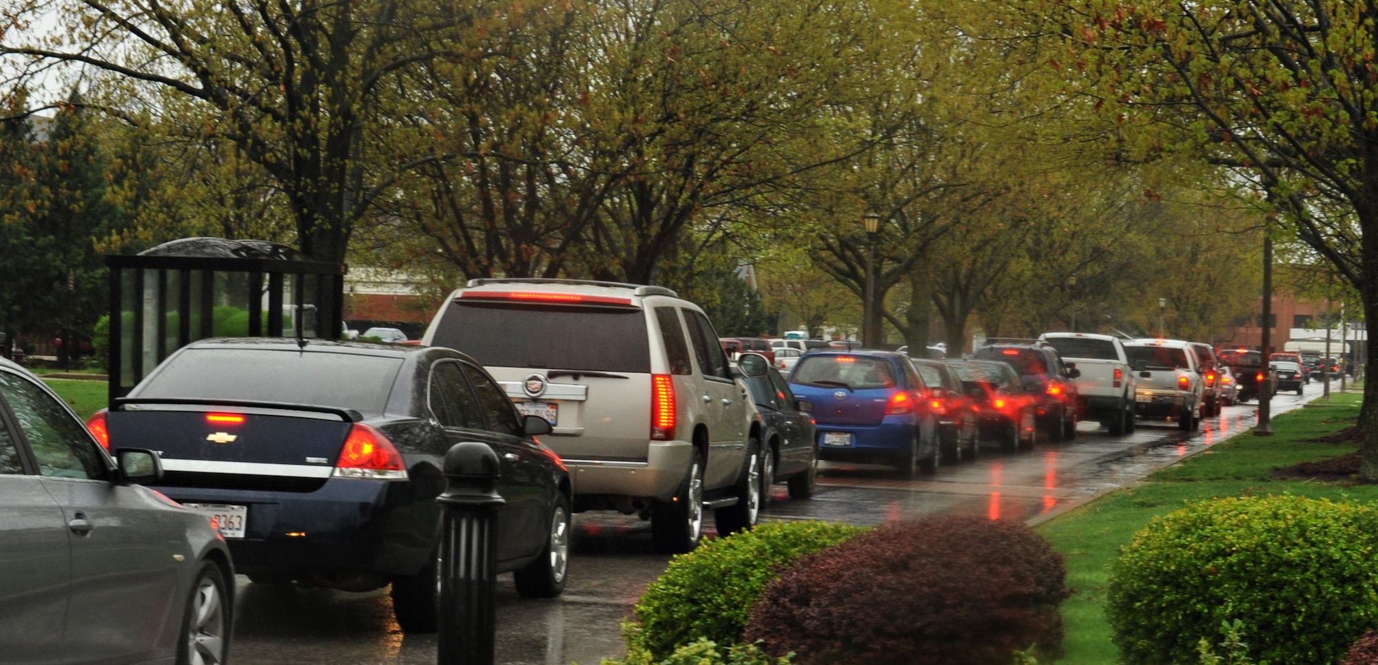 Cars cue up along Heritage Drive waiting to exit Scott Air Force Base, Ill., April. 18, 2013. Between 10:45 a.m. and 4 p.m.  5.2 inches of rain fell.  Commuters waited in line as flooded roads necessitated closing all but Shiloh Gate for exiting the base. Some workers were released early before on- and off-base roads became impassable.  (U.S. Air Force photo/Airman 1st Class Jaeda Waffer)