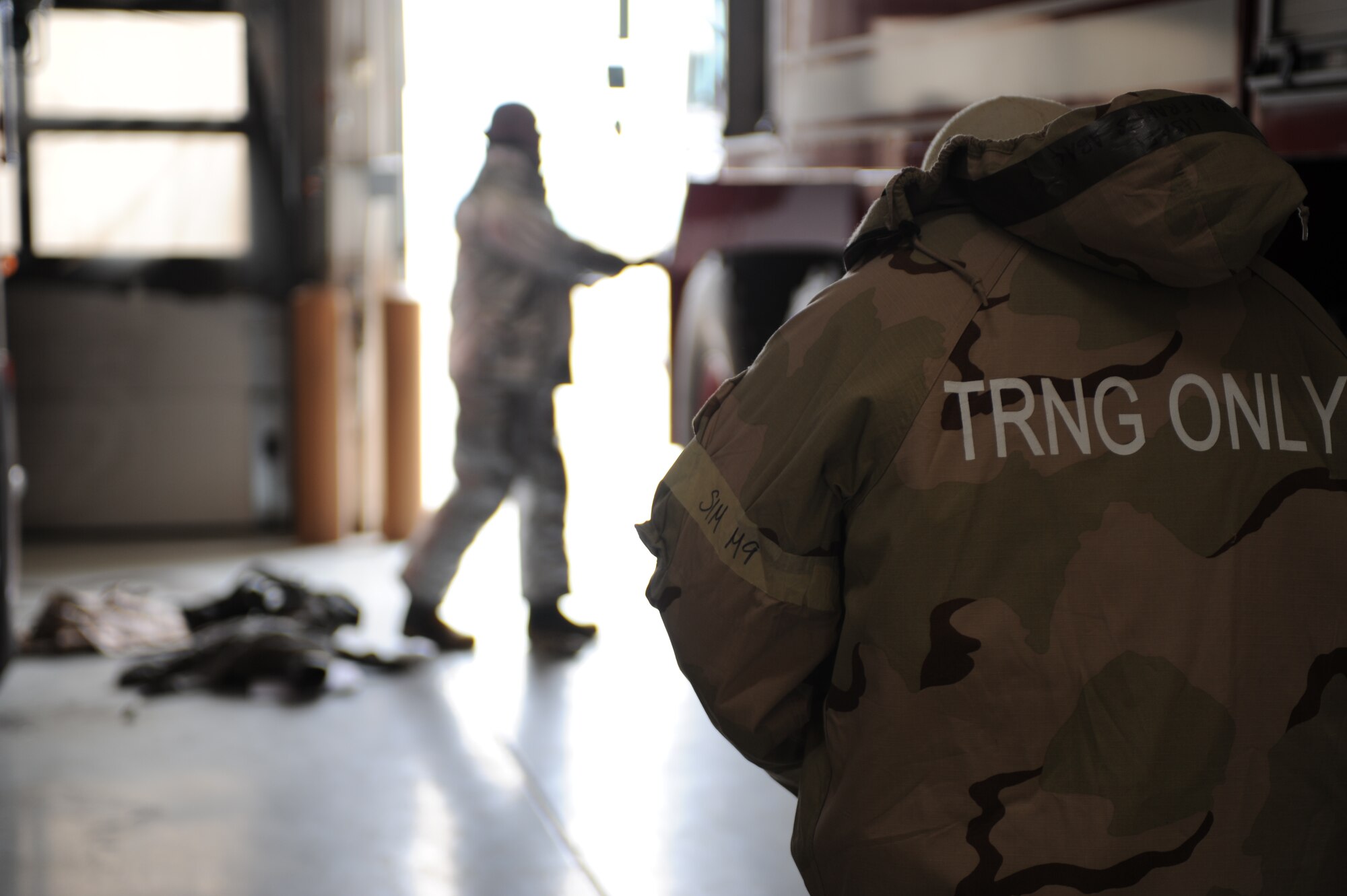 Firefighters suit-up for a training exercise at Mountain Home Air Force Base, Idaho, April 10, 2013. The firefighters tested their response time and how efficient they can be when extinguishing a fire. (U.S. Air Force Photo/Airman 1st Class Malissa Lott)