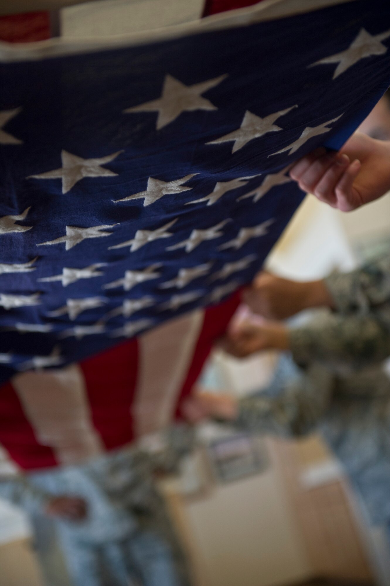 Members of the Steel Talons Honor Guard fold a flag during a flag-folding sequence at Heritage Park at Holloman Air Force Base, N.M., Feb. 20. The Steel Talons Honor Guard was created to honor fallen comrades and those who have served in any branch of the military. They do so by performing a variety of military and civilian ceremonies ranging from posting of the colors at a change of command to full military honors at an active-duty funeral. (U.S. Air Force photo by Senior Airman Joshua Turner/Released) 