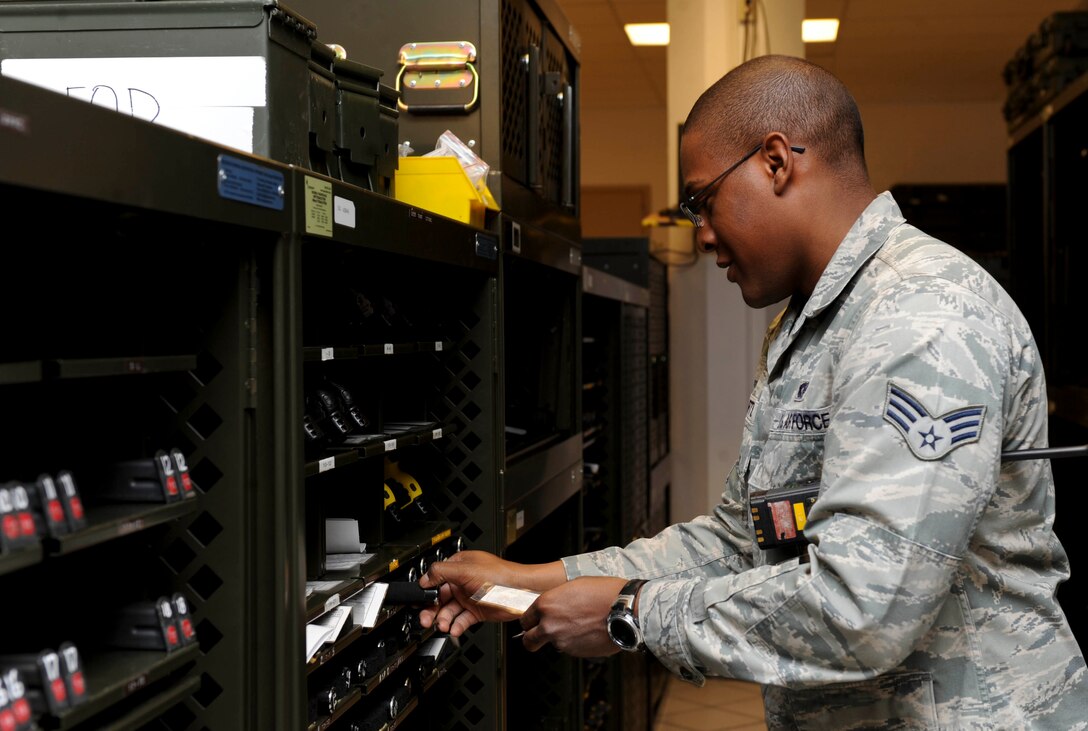 Senior Airman Christopher Curtis, 28th Security Forces armory specialist, retrieves a collapsible baton during weapon issuance at the security forces armory on Ellsworth Air Force Base, S.D., April 4, 2013. Each security forces Airman checks in with the armory to retrieve their assigned weapons and gear prior to duty. (U.S. Air Force photo by Airman 1st Class Anania Tekurio/Released)