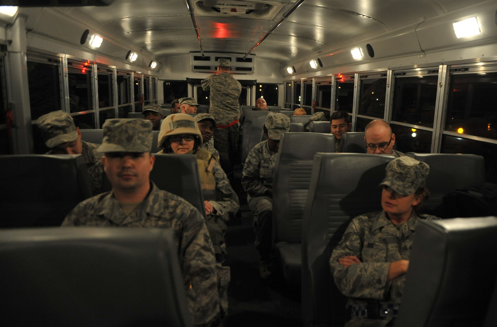 U.S. Air Force members ride a bus to a parking lot with their vehicles during an operational readiness exercise, April 11, 2013, at Mountain Home Air Force Base, Idaho. To add realism to the exercise, participating Airmen must “deploy” on the buses into the exercise area without their vehicles or other conveniences. (U.S. Air Force photo/Senior Airman Heather Hayward)