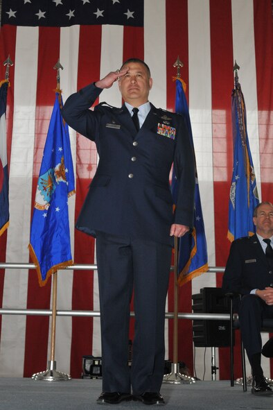Col. Floyd W. Dunstan, commander, 140th Wing, Colorado Air National Guard, salutes members of the wing for the first time as the new commander during a change of command ceremony April 7, 2013 at Buckley Air Force Base. (U.S. Air National Guard photo by Tech. Sgt. Wolfram Stumpf)
