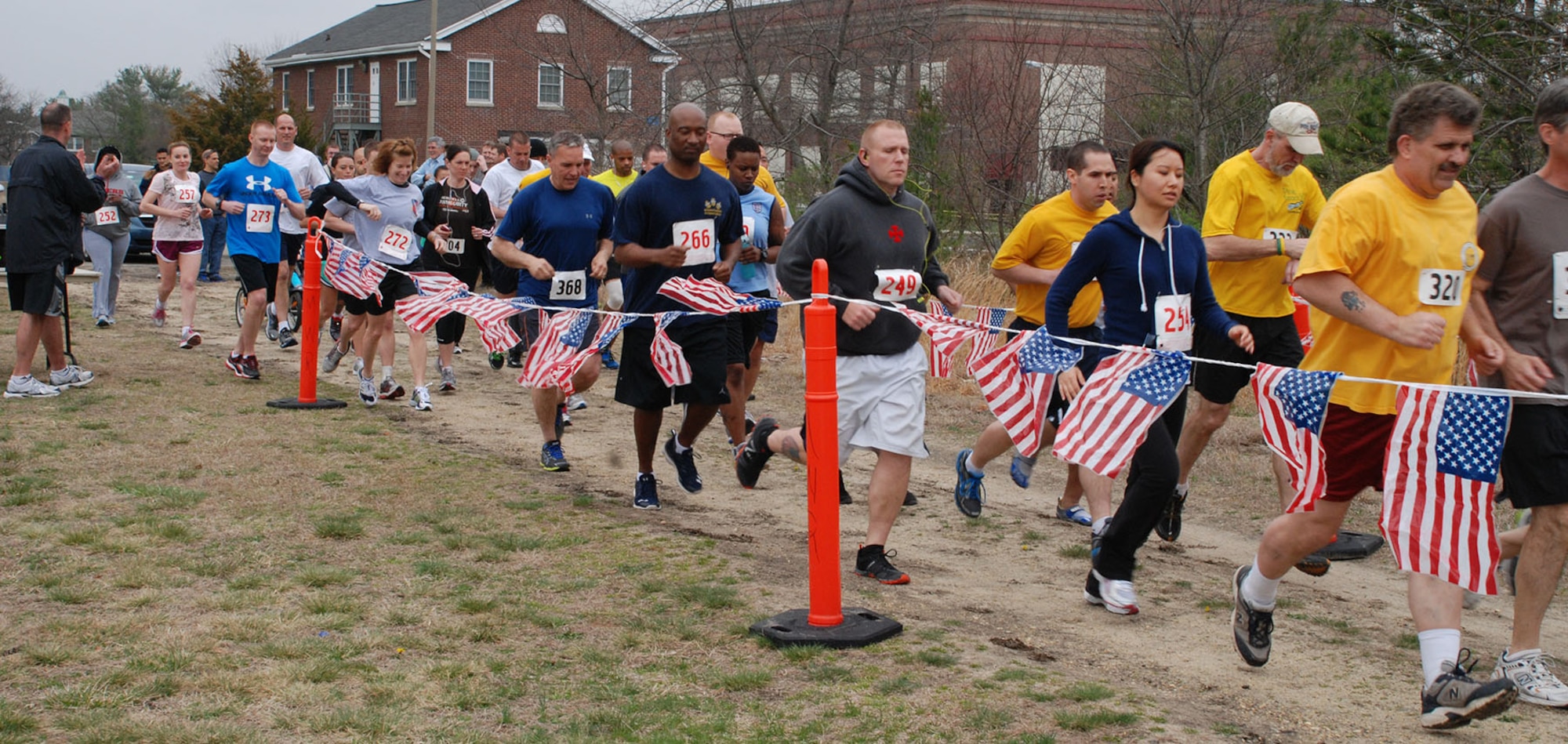 Runners from throughout the joint base celebrate Earth Day by participating in the Earth Day 5K April 11, 2013, at Joint Base McGuire-Dix-Lakehurst, N.J. The event, which was organized by the Moral Welfare and Recreation department, began in front of the Cyber Café on Lakehurst. (U.S. Navy photo by Larry Lyford/Released)