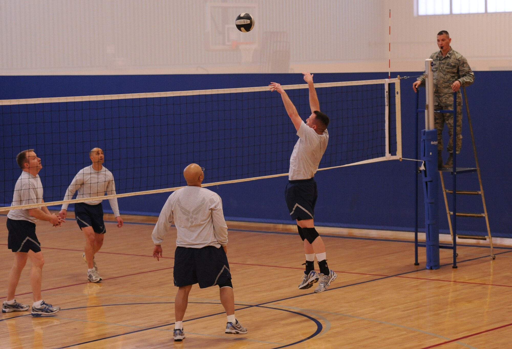 Col. Bruce Roehm, 341st Medical Group commander, spikes a ball over the net during colonels vs. chief master sergeants volleyball game at the Malmstrom Fitness Center on April 17. Malmstrom colonels took the win with a final score of 16 to 14. (U.S. Air Force photo/Airman 1st Class Katrina Heikkinen)