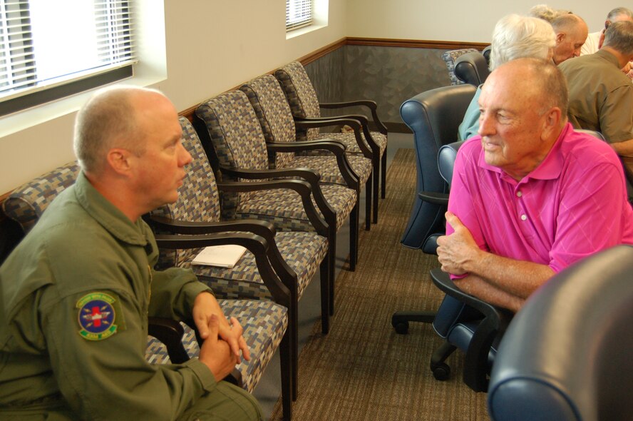 Chief Master Sgt. Rodney Christa, left, superintendent for the 433rd Aeromedical Evacuation Squadron, trades reminiscences with retired Col. Thomas Spruiell, former 433rd Aeromedical Evacuation Group commander. Both attended a meeting and luncheon hosted by 433rd senior leadership for former "Alamo Wing" flyers on April 16. The informal group meets the third Tuesday of every month. (U.S. Air Force Photo/Elsa Martinez)