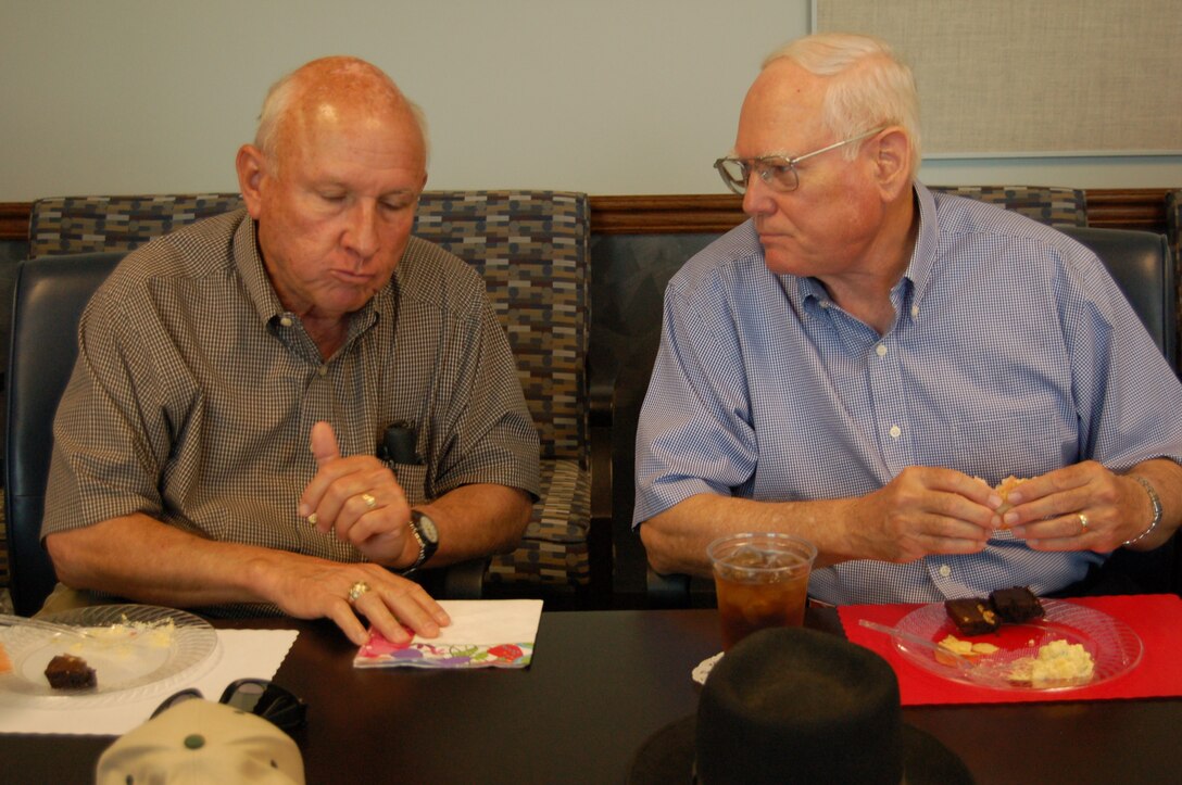 Retired Cols. Gary Spence and Richard Ferguson, both previous commanders of the 433rd Operations Group, catch up on recent events during an April 16 luncheon for former "Alamo Wing" aircrew members.  The informal group, which meets every third Tuesday, held their monthly meeting with 433rd senior leadership. (U.S. Air Force Photo/Maj. Tim Wade)