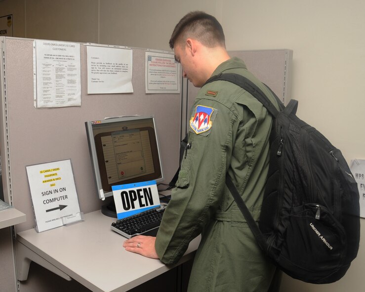 2nd Lt. Jamie Lemieux, 11th Bomb Squadron, signs in at the 2nd Force Support Squadron military personnel section on Barksdale Air Force Base, La., April 18, 2013. The MPS consists of customer service, awards and decorations, passports, personnel assistance management, information desk and client support administrators. (U.S. Air Force photo/Senior Airman Sean Martin)