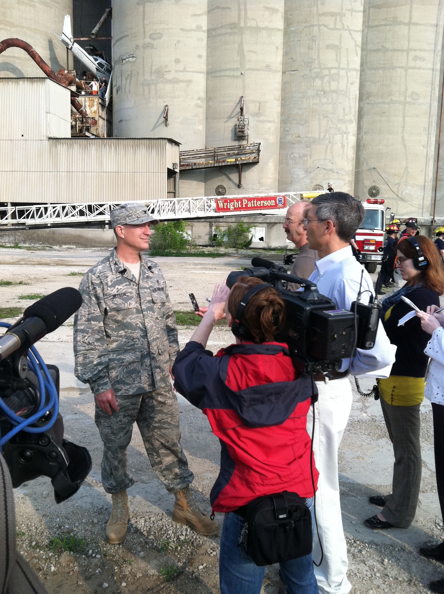 In this file photo, Col. Erik Nelson speaks to news media and public affairs representatives during a May 2011 exercise at "Calamityville," the National Center for Medical Readiness, located in Fairborn, Ohio. Air Force instructions direct only information confirmed to be accurate may be released during accidents or serious incidents. Colonel Nelson is director of medical education and training with the 88th Medical Group at Wright-Patterson Air Force Base, Ohio. (U.S. Air Force photo)