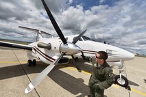 A pilot from the 489th Reconnaissance Squadron performs pre-flight procedures on a C-12 King Air aircraft in preparation for a training sortie at Beale Air Force Base, Calif., April 5, 2013.  (U.S. Air Force photo by Airman 1st Class Drew Buchanan/Released)