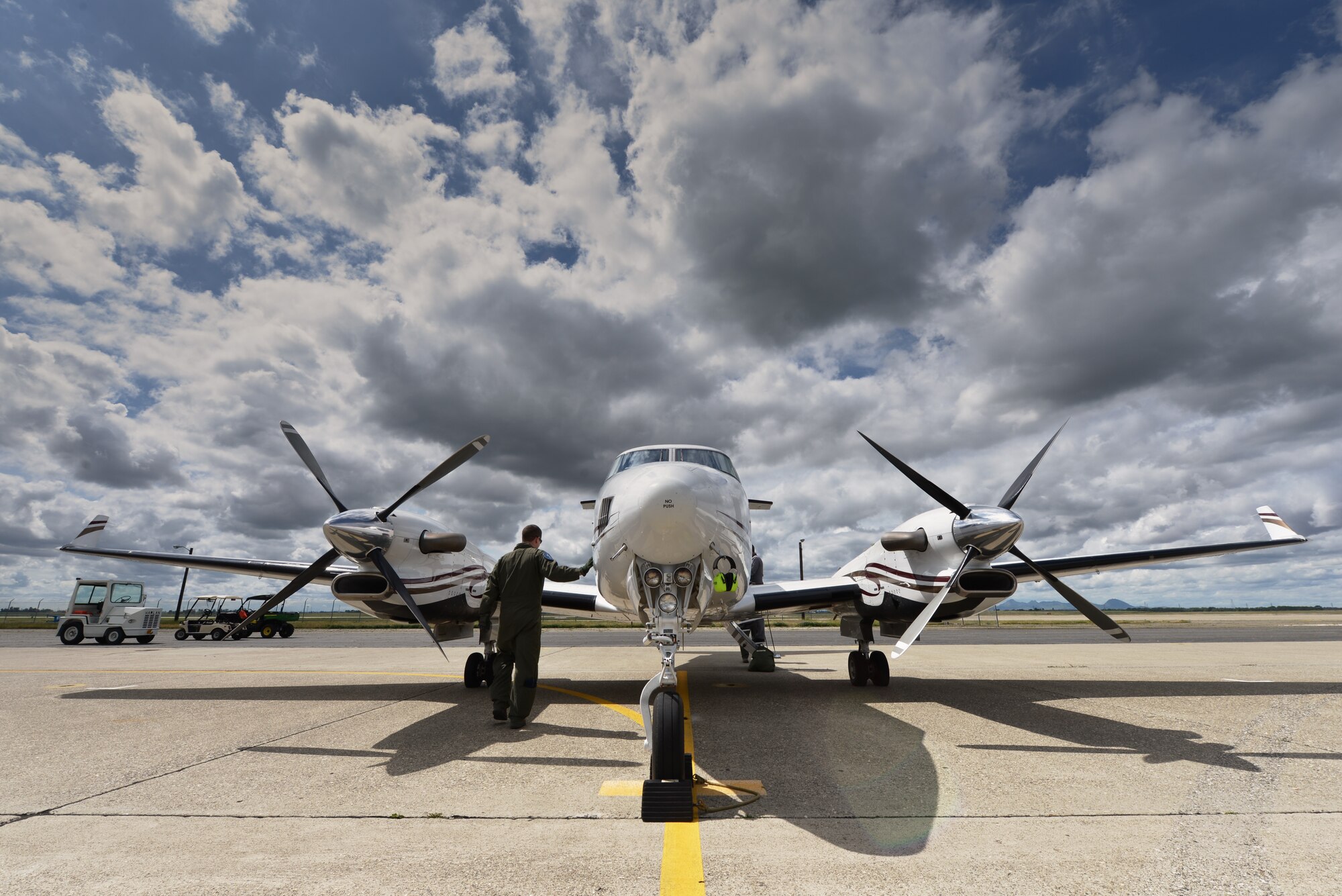 A pilot from the 489th Reconnaissance Squadron performs pre-flight procedures on a C-12 King Air aircraft in preparation for a training sortie at Beale Air Force Base, Calif., April 5, 2013. The aircraft are used to train aircrews for global Intelligence, Surveillance and Reconnaissance operations. (U.S. Air Force photo by Airman 1st Class Drew Buchanan/Released)