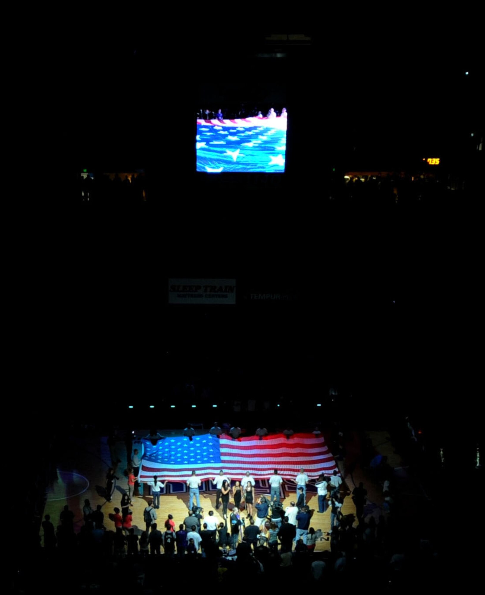 Beale Airmen present the colors during the National Anthem at the Sleep Train Arena for the Sacramento Kings vs. L.A. Clippers game April 17, 2013. Beale Airmen volunteered to help pass out prizes to fans during the contest. (U.S. Air Force photo by Airman 1st Class Bobby Cummings/Released)