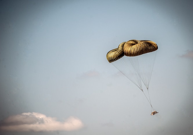 A pallet dropped from a C-17 Globemaster III falls over North Auxiliary Airfield during an exercise April 10, 2013, at Joint Base Charleston – Air Base, S.C. Thirteen C-17s participated in the exercise which included airdrops, aerial refueling and low-level tactical training. The exercise is a total-force effort with aircrews consisting of active-duty Airmen from the 437th Airlift Wing and 315th AW, and completed over 600 training requirements in a single day.  (U.S. Air Force photo/ Senior Airman Dennis Sloan)
