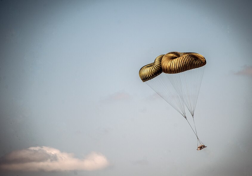 A pallet dropped from a C-17 Globemaster III falls over North Auxiliary Airfield during an exercise April 10, 2013, at Joint Base Charleston – Air Base, S.C. Thirteen C-17s participated in the exercise which included airdrops, aerial refueling and low-level tactical training. The exercise is a total-force effort with aircrews consisting of active-duty Airmen from the 437th Airlift Wing and 315th AW, and completed over 600 training requirements in a single day.  (U.S. Air Force photo/ Senior Airman Dennis Sloan)