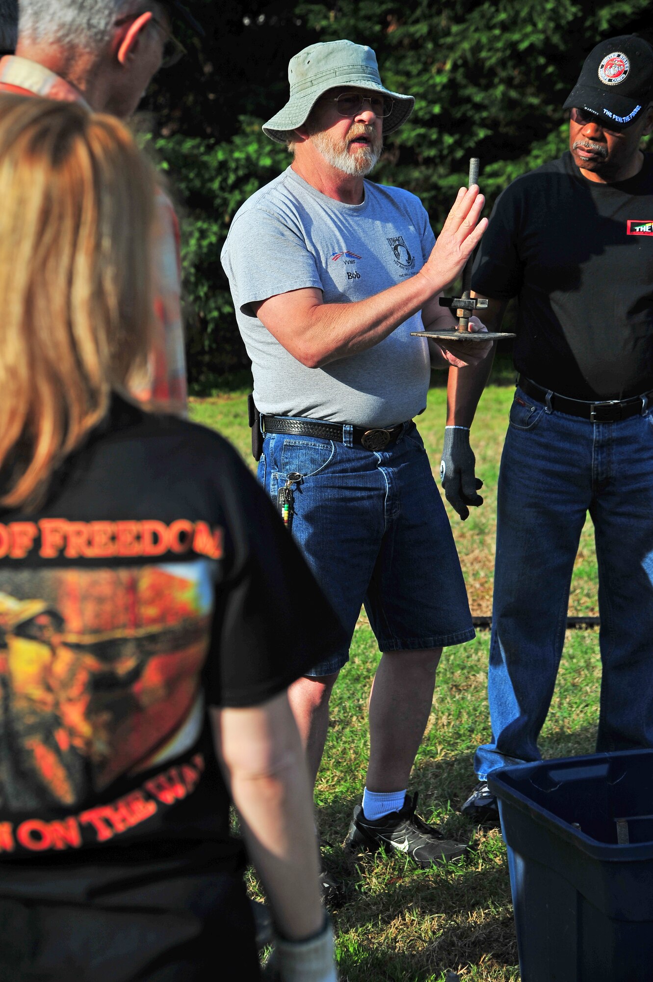 Bob Dobek, Vietnam Veterans Memorial Traveling Wall site manager, explains how to position pieces of the wall at the Wayne Community College campus in Goldsboro, N.C., April 17, 2013. Several members of the local community came together to assemble the wall, which will be accessible for viewing, 24-hours-a-day from April 18 through sunrise on April 21. (U.S. Air Force photo by Airman 1st Class Aubrey White/Released)
