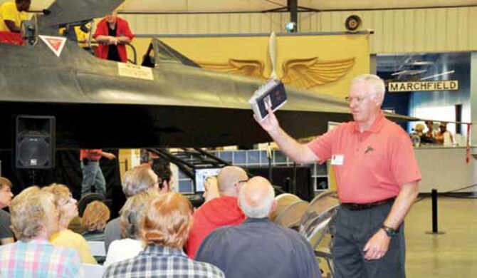 Retired Lt. Col. Gerald Glasser, former SR-71 Blackbird pilot, addresses a crowd of spectators at the March Field Air Museum presentation of the SR-71, the world’s fastest aircraft, April 6 and 7. Glasser, along with other former Blackbird pilots delivered a host of memorable events, spoke of little-known facts about the aircraft  and mingled with the visitors. The pilots were on hand for the popular annual two-day event, which continues to draw larger and larger audiences. (U.S. Air Force photo by Staff Sgt. Joe Davidson)