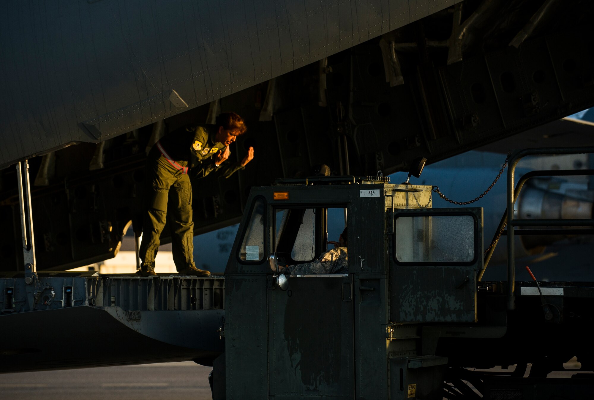 Chief Master Sgt. Jeanette King, 437th Operations Group superintendent, marshals in a k-loader to load cargo during a training exercise April 10, 2013, at Joint Base Charleston – Air Base, S.C. Thirteen C-17s participated in the exercise which included airdrops, aerial refueling and low-level tactical training. The exercise is a total-force effort with aircrews consisting of active-duty Airmen from the 437th Airlift Wing and 315th AW, and completed over 600 training requirements in a single day. (U.S. Air Force photo/ Senior Airman George Goslin)