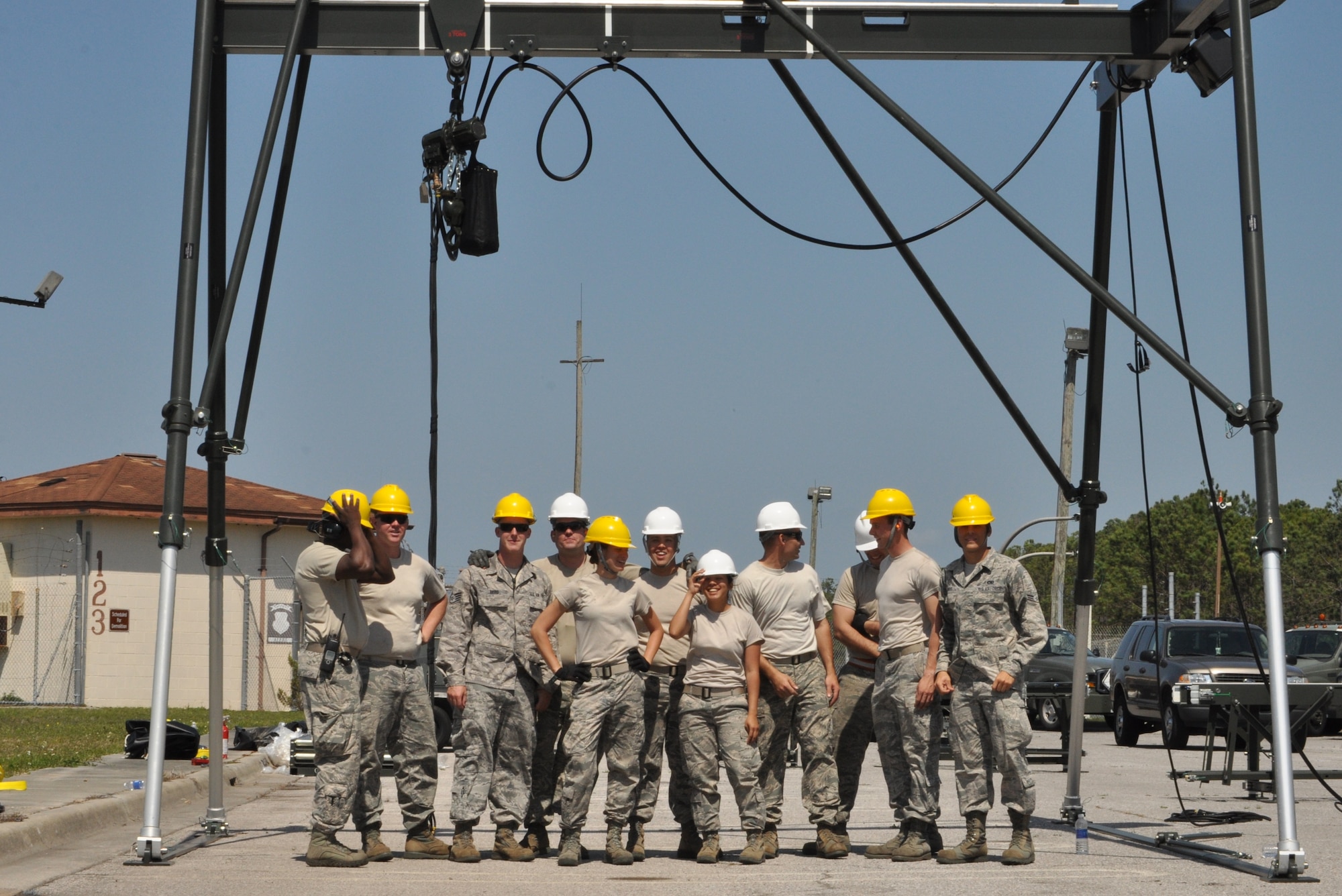Members of the 325th Maintenance Squadron build the Munitions Assembly Conveyor II for the first time on April 10 in the Alert Facility parking lot on Tyndall Air Force Base. The MAC II is a system that acts as an assembly line for munitions and speeds up the process of their build. (U.S. Air Force photo by Airman 1st Class Alex Echols)