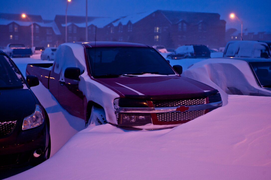 Vehicles are buried under 21 inches of snow in a dormitory parking lot at Ellsworth Air Force Base, S.D., April 10, 2013 during a snowstorm. The average annual amount of snowfall in South Dakota is 24 to 30 inches across most of the state, and 60 to 100 inches in the Black Hills. (U.S. Air Force photo by Airman 1st Class Zachary Hada/Released)