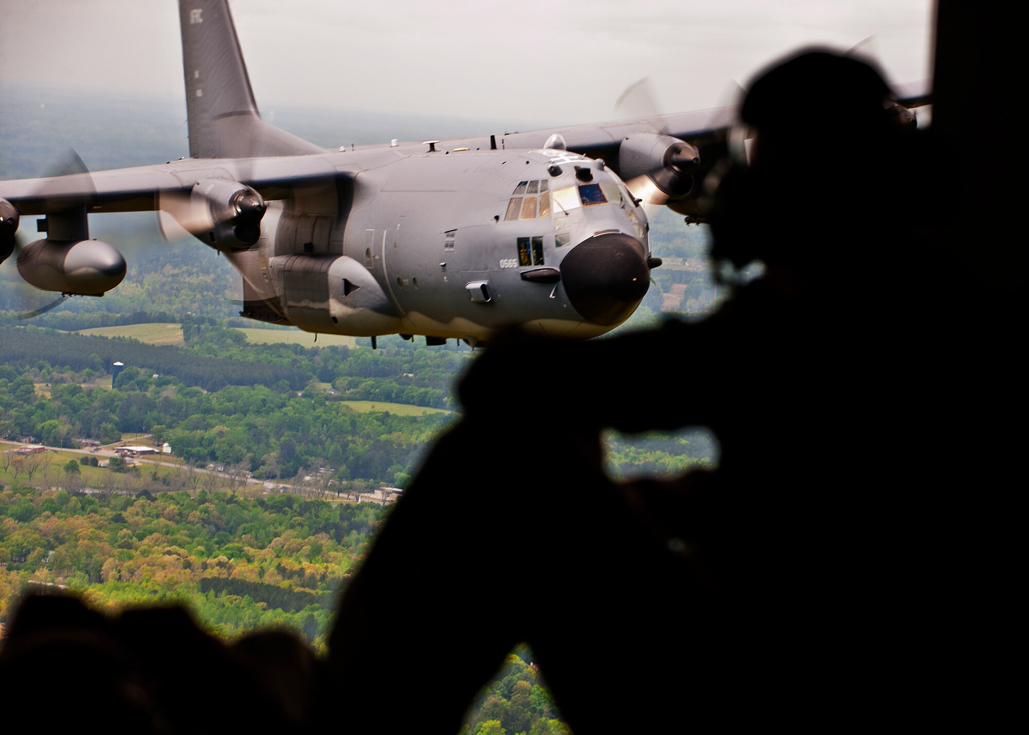 A loadmaster with the 919th Special Operations Wing admires his aircraft, the MC-130E Combat Talon I, in flight one last time April 15 during its final flight before retirement.  The last five Talons in the Air Force belong to the 919th SOW and are scheduled to be retired at a ceremony April 25.  They will make one final flight to the “boneyard” at Davis-Monthan Air Force Base, Ariz., by the end of the fiscal year.  (U.S. Air Force photo/Tech. Sgt. Samuel King Jr.)